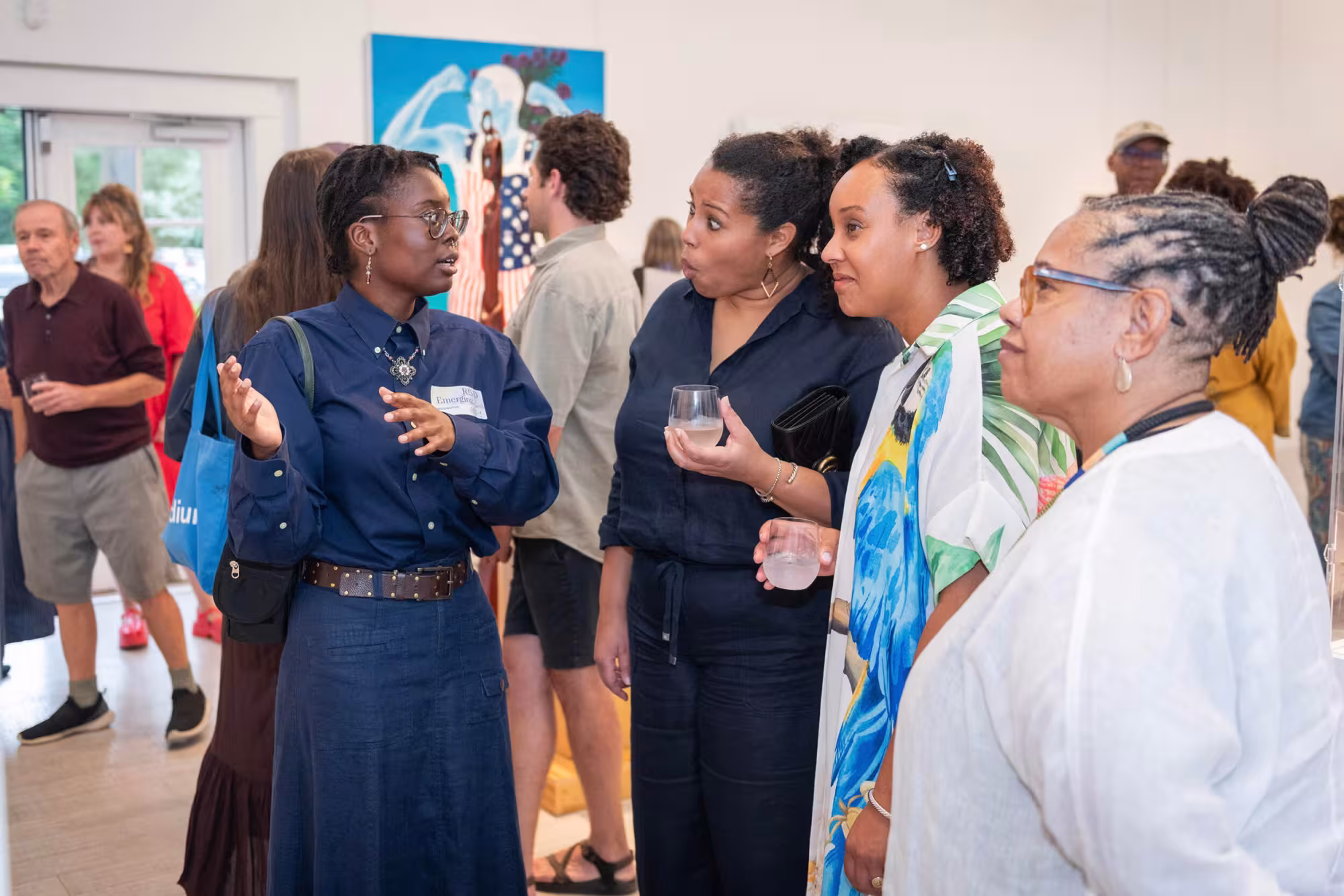 Asojo talking with exhibitiongoers
