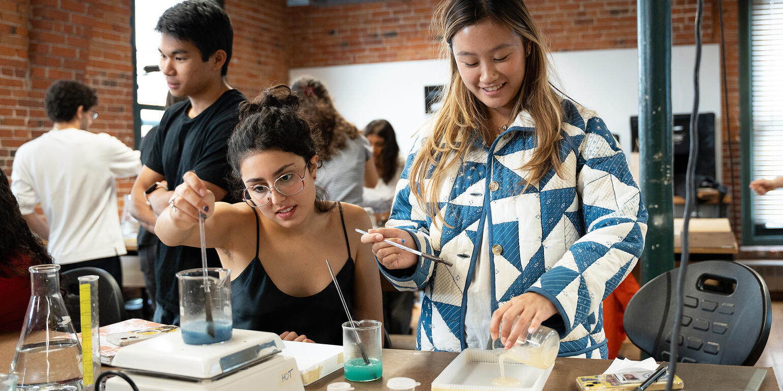 Two students mixing bioplastics