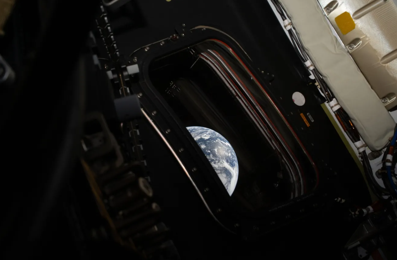 image of earth from inside the spaceship cabin